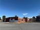 Close shot of the property's brown single story exterior with gravel surround at 641 West St, Pahrump, NV 89048