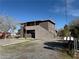 Two-story building features a simple design and exterior staircases providing access to the upper units at 641 West St, Pahrump, NV 89048