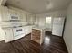 Bright kitchen featuring white cabinets, modern appliances, and a central island with wood paneling at 641 West St, Pahrump, NV 89048