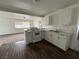 Bright kitchen featuring white cabinetry, counter seating, and modern appliances at 641 West St, Pahrump, NV 89048