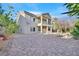 View of the expansive backyard with paving stones and mature landscaping at 65 Pangloss St, Henderson, NV 89002
