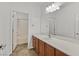 This bathroom features a long countertop with a sink, mirror and vanity lighting at 65 Pangloss St, Henderson, NV 89002