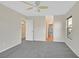 Spacious bedroom with neutral walls, carpet flooring, and ceiling fan at 65 Pangloss St, Henderson, NV 89002