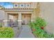Cozy front porch and entryway with desert landscaping and decorative greenery at 65 Pangloss St, Henderson, NV 89002