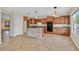 Well-equipped kitchen with wood cabinets, an island, and modern appliances at 65 Pangloss St, Henderson, NV 89002