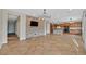 Spacious living room opening up to the kitchen and featuring stone accent wall at 65 Pangloss St, Henderson, NV 89002