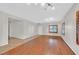 Spacious living room featuring light walls, hardwood floors, and natural light at 65 Pangloss St, Henderson, NV 89002