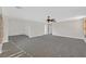 This living room features carpeted floors and natural light at 65 Pangloss St, Henderson, NV 89002
