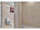 Bathroom featuring a toilet, cabinet and a tiled shower at 6882 Palmyra Ave, Las Vegas, NV 89146