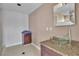 Stylish bathroom with a glass vessel sink, granite countertop, and modern faucet at 6882 Palmyra Ave, Las Vegas, NV 89146