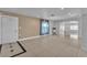 Inviting foyer with tile flooring and a view into the spacious living area and front door at 6882 Palmyra Ave, Las Vegas, NV 89146