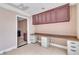 Well-lit office area with custom desk, storage, and tiled floors at 6882 Palmyra Ave, Las Vegas, NV 89146