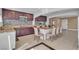 Stylish kitchen boasting granite counters, dark cabinetry, and a breakfast bar with seating at 6882 Palmyra Ave, Las Vegas, NV 89146