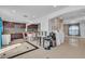 Bright kitchen featuring granite countertops and stainless appliances with an adjacent island at 6882 Palmyra Ave, Las Vegas, NV 89146