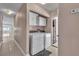 Laundry room with washer, dryer, and storage cabinets at 6882 Palmyra Ave, Las Vegas, NV 89146
