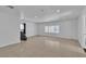 Bright living area with tile flooring and natural light streaming through the window at 6882 Palmyra Ave, Las Vegas, NV 89146