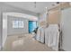 Bright, airy living room with large window and arched doorway to the exterior at 6882 Palmyra Ave, Las Vegas, NV 89146