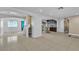 Open-concept living area featuring tiled floors and seamless transitions to the kitchen at 6882 Palmyra Ave, Las Vegas, NV 89146