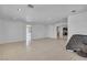 Open-layout living area with tile flooring and seamless access to other living spaces at 6882 Palmyra Ave, Las Vegas, NV 89146