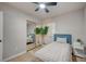 Charming bedroom featuring a mirrored closet, light wood floors, stylish decor, and natural light at 700 Cactus Ln, Las Vegas, NV 89107