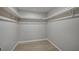 Spacious walk-in closet featuring white shelving and modern flooring for optimal storage and organization at 700 Cactus Ln, Las Vegas, NV 89107