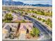 Expansive aerial view of the home in a lovely community with desert landscaping and mountain views at 7556 Wingspread St, North Las Vegas, NV 89084