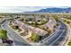 Residential area with neat landscaping, tile roofs, and a view of the mountains in the distance at 7556 Wingspread St, North Las Vegas, NV 89084