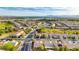 High angle aerial shot of a well-planned community, showcasing tidy streets, manicured lawns, and golf course at 7556 Wingspread St, North Las Vegas, NV 89084