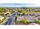 Expansive aerial view of a residential community featuring well-maintained homes, landscaping, and a glimpse of the city skyline at 7556 Wingspread St, North Las Vegas, NV 89084
