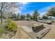 A bocce ball court with natural wood borders in a green landscaped community at 7556 Wingspread St, North Las Vegas, NV 89084