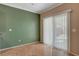 Breakfast nook with green accent wall and large sliding glass doors at 7556 Wingspread St, North Las Vegas, NV 89084