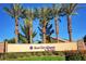 Entrance sign of Sun City Aliante by Del Webb against a clear blue sky with palm trees in background at 7556 Wingspread St, North Las Vegas, NV 89084