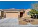 Charming single-story home featuring a two-car garage and xeriscaping for low maintenance and water conservation at 7556 Wingspread St, North Las Vegas, NV 89084