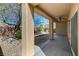 Inviting covered patio with textured columns and a view of the landscaped backyard at 7556 Wingspread St, North Las Vegas, NV 89084