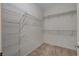 This walk-in closet features ample shelving and is ready for organization and storage at 7556 Wingspread St, North Las Vegas, NV 89084