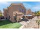Spacious backyard with a gazebo, artificial turf, and mature landscaping at 7641 Lani Dawn St, Las Vegas, NV 89149