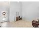 Bright entryway with tiled floor, a front door with decorative glass and a storage cabinet with a woven drawer at 7641 Lani Dawn St, Las Vegas, NV 89149