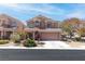 Charming two-story home featuring a well-manicured front yard and inviting curb appeal at 7641 Lani Dawn St, Las Vegas, NV 89149