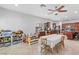 Bright, open floorplan features modern kitchen with stainless steel appliances, an island, and a breakfast bar at 7641 Lani Dawn St, Las Vegas, NV 89149