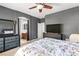 Main bedroom features gray walls and a large dresser with TV above it at 7641 Lani Dawn St, Las Vegas, NV 89149