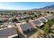 Aerial view of home shows its backyard, patio, roof, and proximity to other homes in the community at 7760 Pine Warbler Way, North Las Vegas, NV 89084