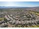 An aerial view showcases the well-planned community and neighborhood featuring green spaces and attractive desert landscaping at 7760 Pine Warbler Way, North Las Vegas, NV 89084