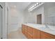 Bathroom with double vanity, ample storage, and tile flooring at 7760 Pine Warbler Way, North Las Vegas, NV 89084