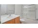 Bathroom with a single sink, mirror, and a shower with glass doors at 7760 Pine Warbler Way, North Las Vegas, NV 89084