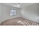 A bright bedroom with a window with blinds at 7760 Pine Warbler Way, North Las Vegas, NV 89084