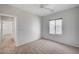 A bright bedroom with a window and a door leading to the hall at 7760 Pine Warbler Way, North Las Vegas, NV 89084