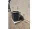 Exterior view of an air conditioning unit next to the building's wall at 7760 Pine Warbler Way, North Las Vegas, NV 89084