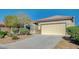Attractive single-story home with low-maintenance landscaping, a spacious driveway, and a welcoming entrance at 7760 Pine Warbler Way, North Las Vegas, NV 89084