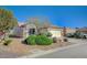 Lovely single-story house featuring desert landscaping, a two-car garage, and a serene neighborhood setting at 7760 Pine Warbler Way, North Las Vegas, NV 89084