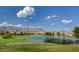 Breathtaking view of the golf course with lake and mountain backdrop, perfect for leisurely rounds and scenic vistas at 7760 Pine Warbler Way, North Las Vegas, NV 89084